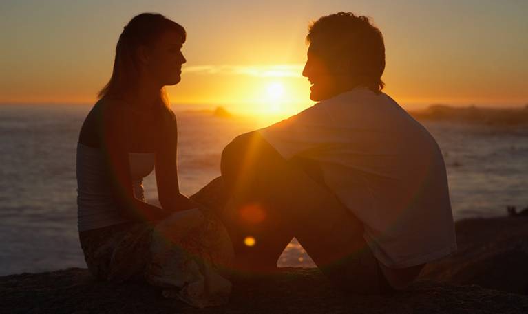 couple on beach at sunset
