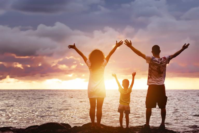 family on beach in Hawaii