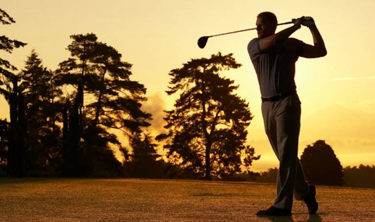golfer at sunset