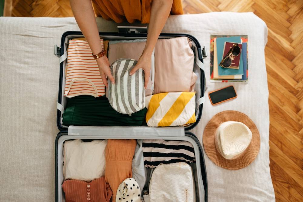 Woman packing suitcase