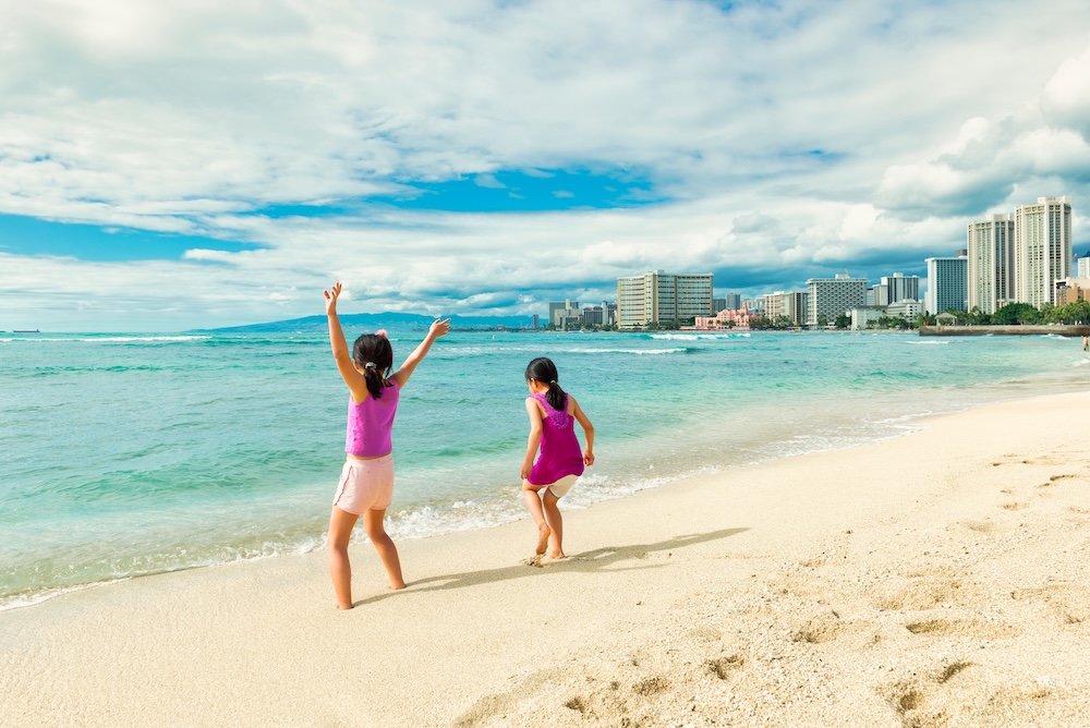 Kids playing on beach in Waikiki